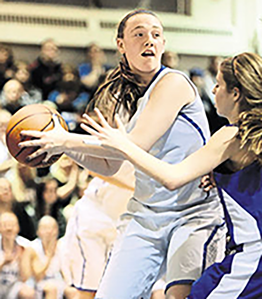 Senior Katie Furlong prepared for Team Wisconsin's tournaments throughout last season's basketball games.