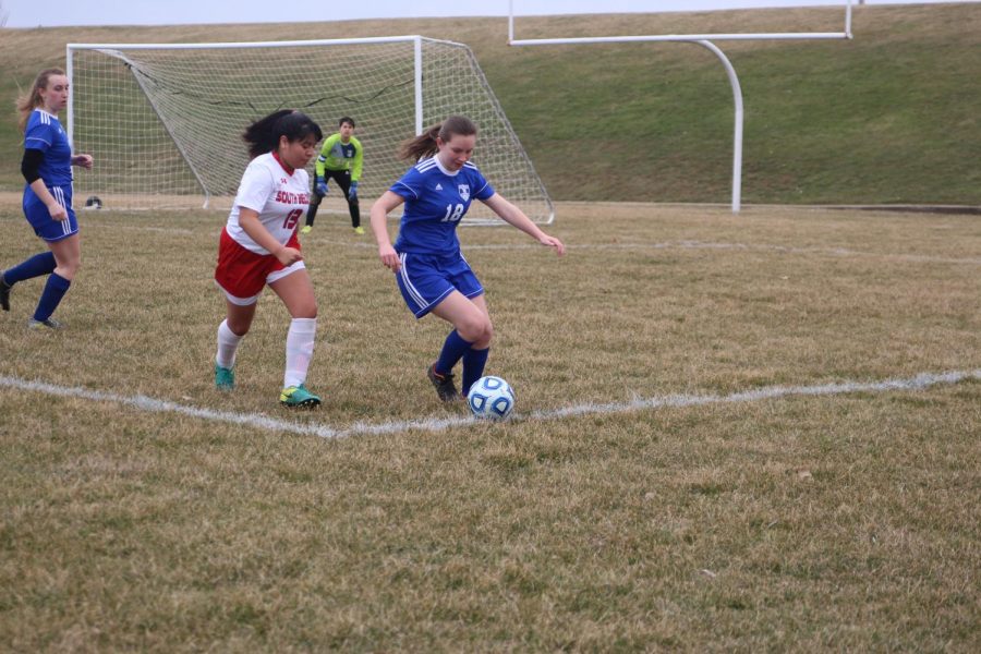 Junior Izzy Sommers races to the ball. The team won with a score of 7-1 which is a record high for the team. “We get better everyday at practice and I hope we do well this season!”
