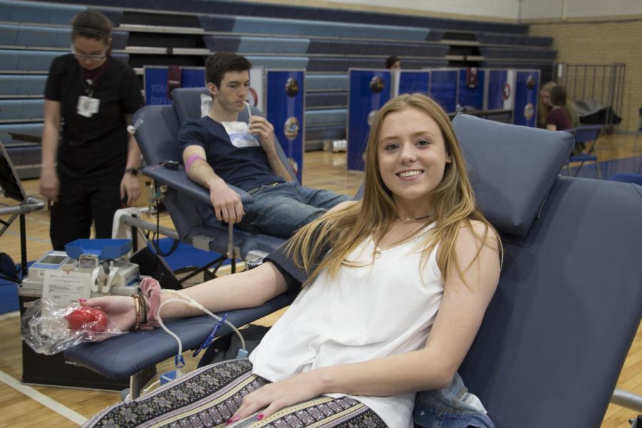 Morgan McIntyre ‘21 smiles at the camera while giving her blood. “I will for sure be doing this again,” said McIntyre. 
