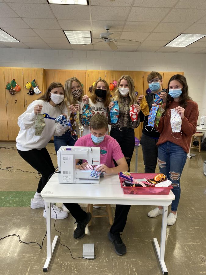 All in making masks for the community, Danielle Stephanopoulos ‘23, Julia Townsend ‘23, Morgan McIntyre ‘21, Kate Moran ‘21, Alex Oberbroeckling ‘23, Maddy Glasgow ‘22, and Spencer Crawford ‘21 display the large selection of masks they created for the hospital. These students took on the task of making masks after Mrs. Bookless saw on Facebook that the Midwest Medical Center was asking for volunteers to donate. “No volunteer work I have done in the past compares to this,” said Morgan McIntyre ‘21. “Not only did we get to practice our sewing skills, but we get the satisfaction of knowing they are going to help others.”