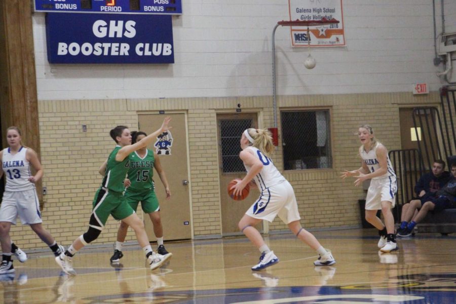 Striding for greatness. Corrina Noble ‘21 drives a ball down the court in a past 2019 game against Wethersfield High School. “I am really excited to see how this season goes. It’s going to be a very different experience, but I am trying to look at it in the most positive way possible to ensure that this season will be fun and successful” , stated Noble.
