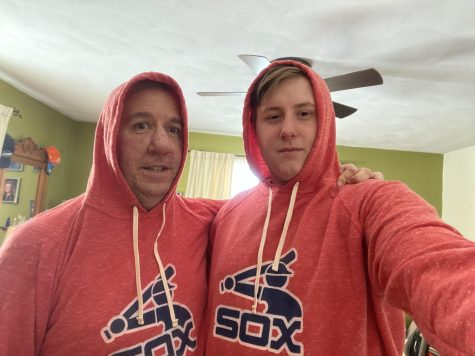 Caleb Soat ‘23 and his dad Ben wearing matching hoodies for the remote day. 
