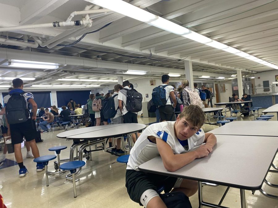The surrounding tables have been abandoned by freshmen who can be seen standing in the middle of the lunch room socializing, except for Roman Romer 26. “I just want to sit and relax after chowing down on my lunch,” says Romer. 