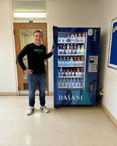 John Wubben stands next to the GHS vending machine located to the right of the teachers lounge. This vending machine has given students a great option to stay hydrated while at school. “The rising popularity of the vending machine has kept me busy restocking it,” Wubben said, “Lately Ive even been restocking it multiple times a week.”