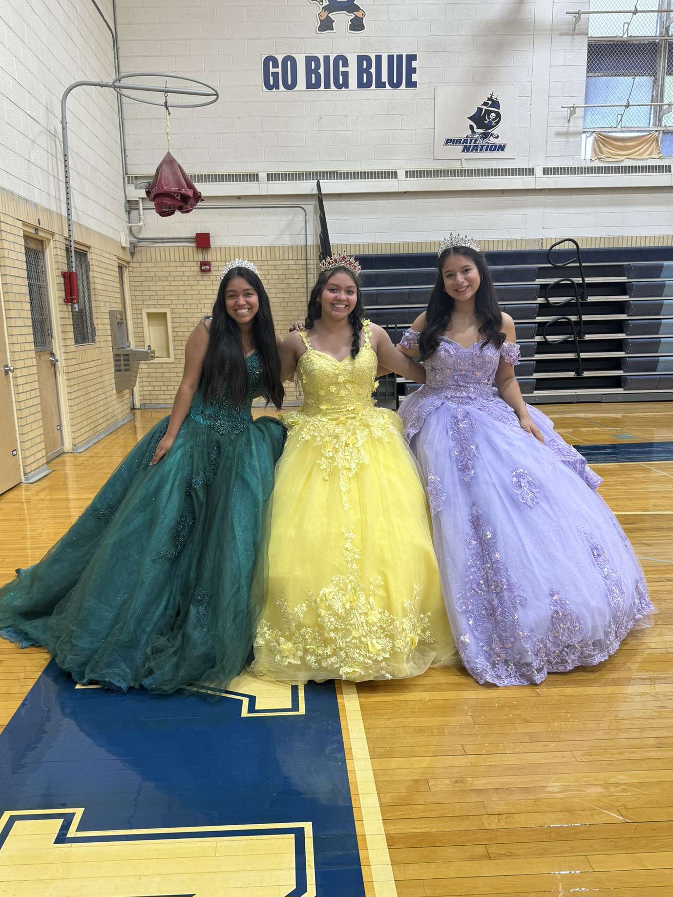 Shimmering in Glitter! Sarah Bello ‘25, Daniela Bello ‘26, and Vanesa Vazquez ‘27 beam with joy after struggling to get to their first class, P.E. They planned to wear their quinceañera dresses two weeks before dress-to-impress day, “All of them agreed, so I wasn’t alone,” said S. Bello.