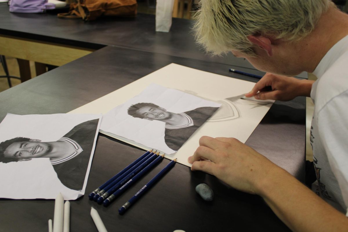 Getting artsy,  Max Schulz '26 illustrates Jordan Love coming to life on paper during the first NAHS studio night on October 1st. "I chose to do Jordan Love for this project because he is the quarterback for my favorite team, the Packers."