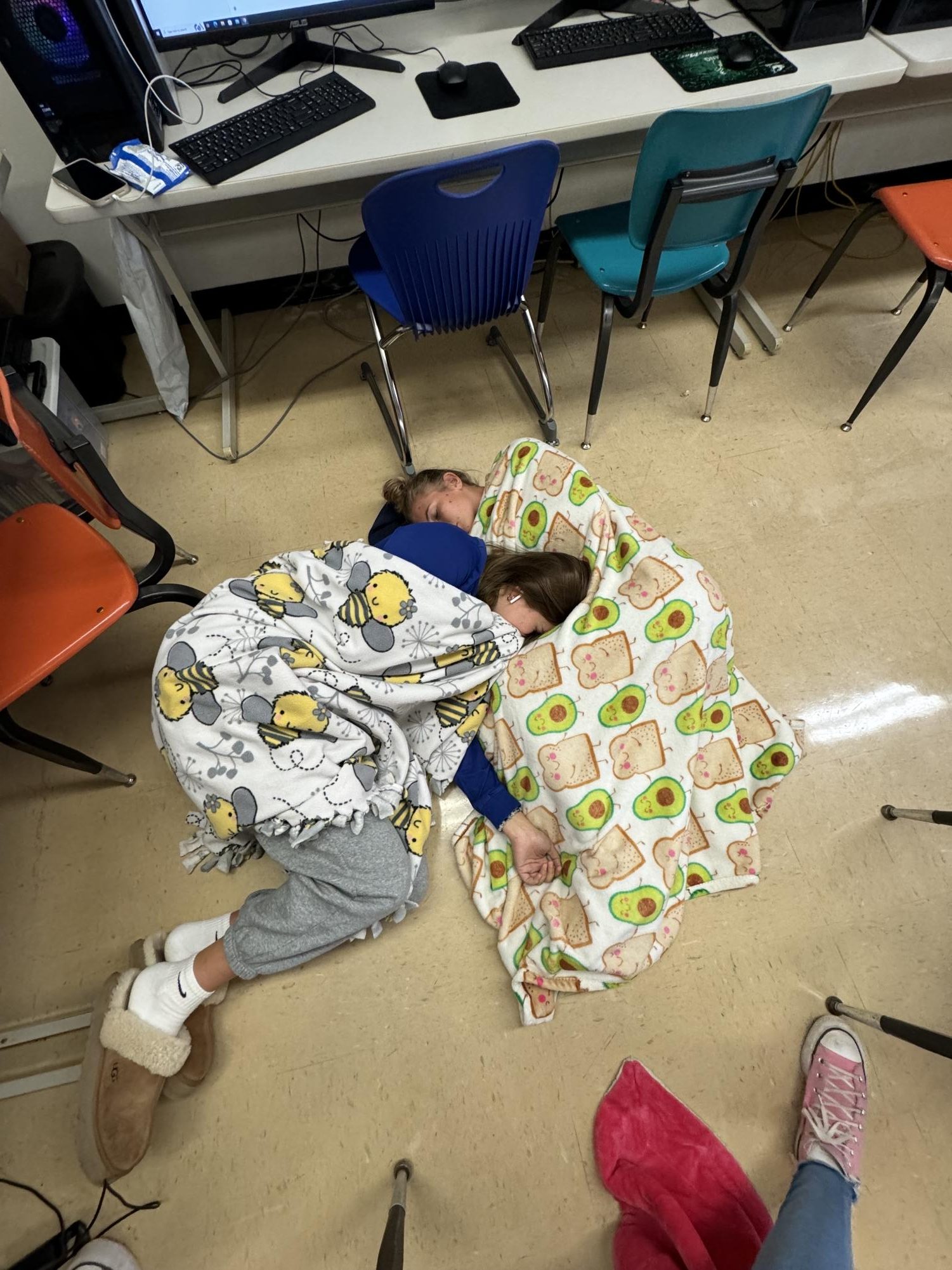 Ell Law and Cameron Einsweiler slumped on the pub's classroom floor. “ We were so tired after writing our amazing article on Sophomore Slump,” they said.