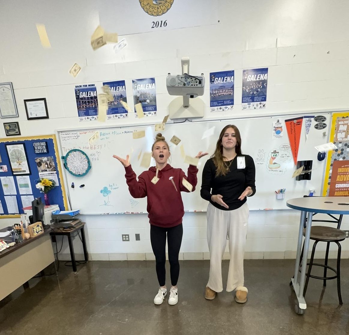 Ell Law and Cameron Einsweiler (Camellon) throwing up fake money in the AG room. “We were just celebrating our amazing article about girl math,” said Camell