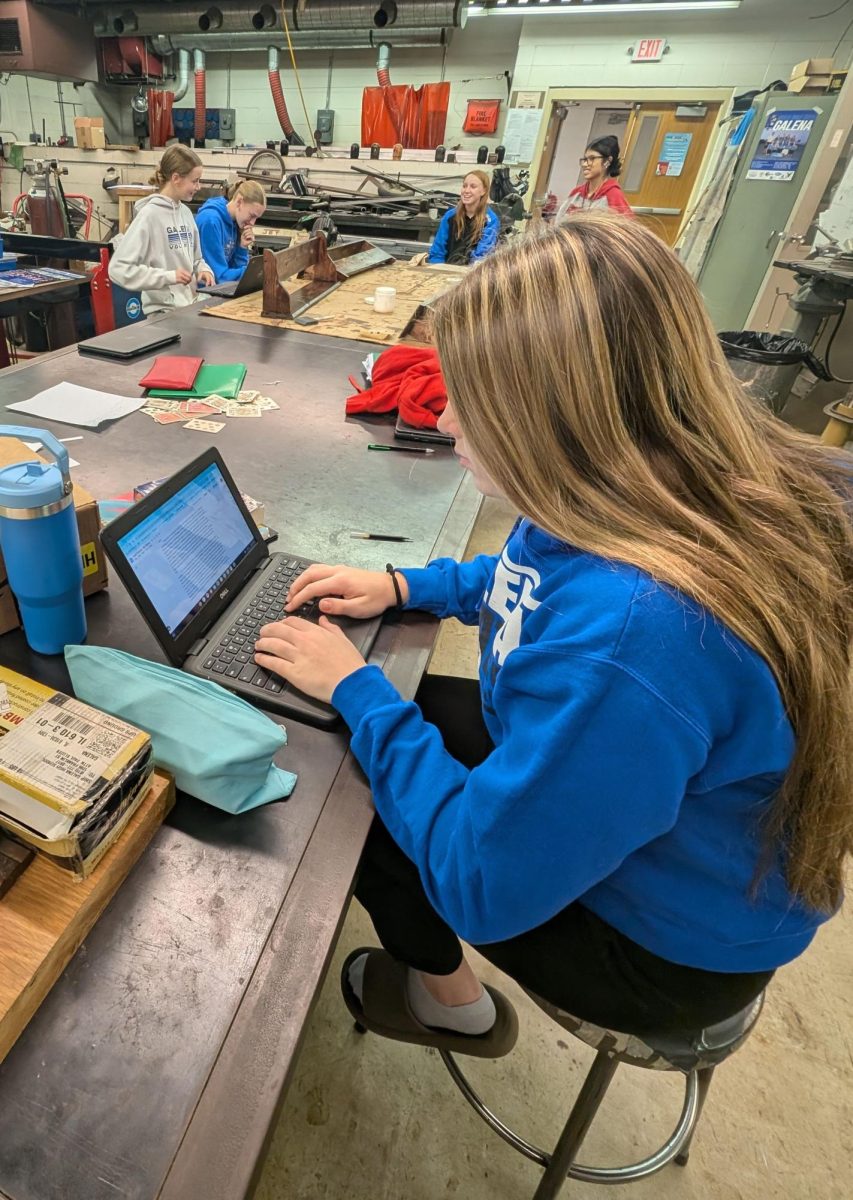 Freshman Leah Vincent had extra time in Woods Class while waiting for her project to dry so she chose to be very productive and work on an essay for English Class.