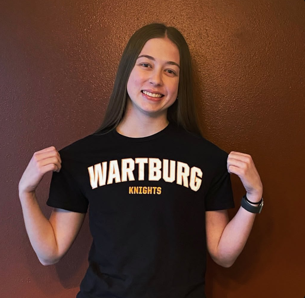 Class of 2025 Abigale Merritt is posing proudly wearing a shirt from Wartburg Knights College that she committed to for playing sports and academics! Merritt said, “I was super excited to figure out what was next. I am super excited to play volleyball at the next level and continue my academics in physical therapy.”