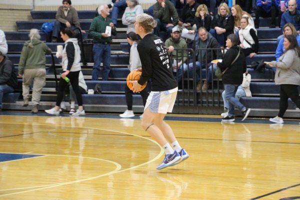 He Shoots and He Scores! Owen Hefel ‘26 practicing his 3-pointer shots before the game. During this game, Hefel made 2 three-pointers. 