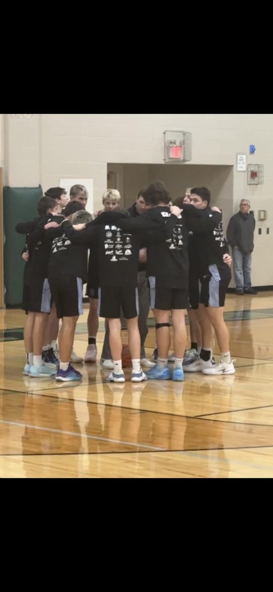 Huddle Up!! The Galena Boys Varsity Basketball Team gathers as a team to talk about what they are going to do during the game against West Carroll