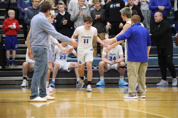 Watch out! Myles Schumacher, ‘25, walking out of the with confidence and with one goal in mind, to win. “We had this game circled on our schedule and we knew they did too. Whoever won this game was going to play the best basketball they have ever played,” Schumacher ‘25. 