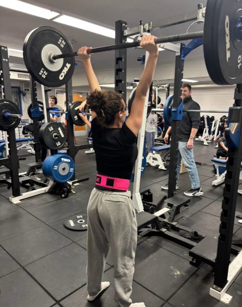 Alivia Northrup ‘27, performs a push press set with 115 lbs on the bar. She has been a concurrent and dedicated member of the Galena Barbell Club. 