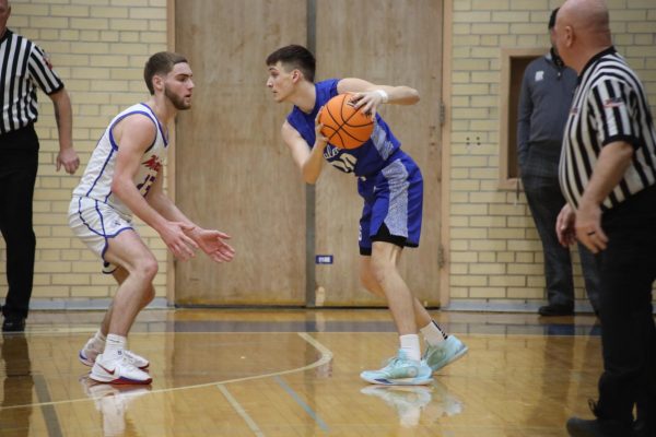 Sike! Mason Smith ‘26 going head-to-head against Brody Culbertson ‘25 to the hoop for a shot. Pirates lost against the East Dubuque Warriors 48-57.