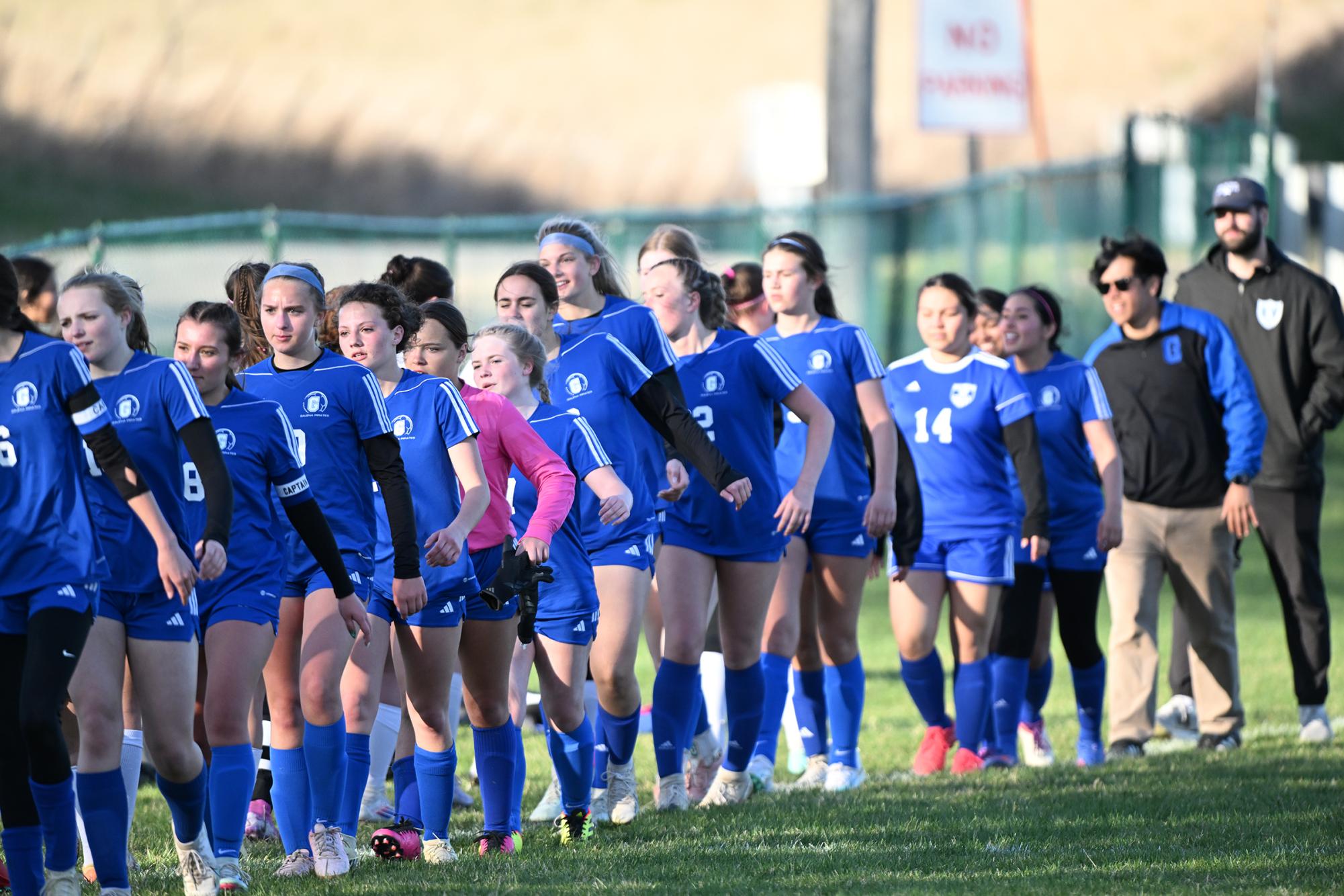 Galena shaking hands after the first victory of the game. 