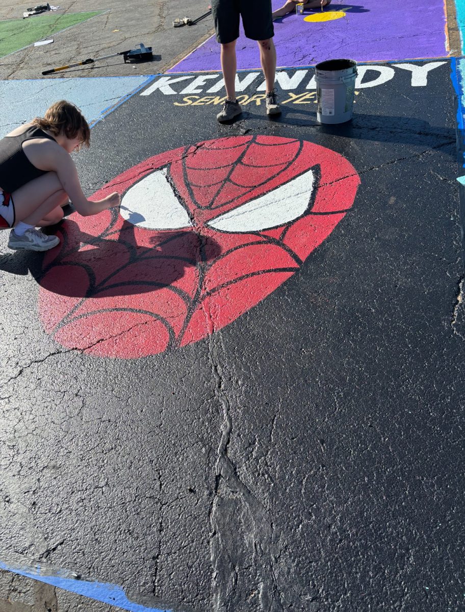 Kennedy Roddick painting her senior parking spot. “I love the idea of senior parking I think it is a way to give the senior class a little extra love!” she said.