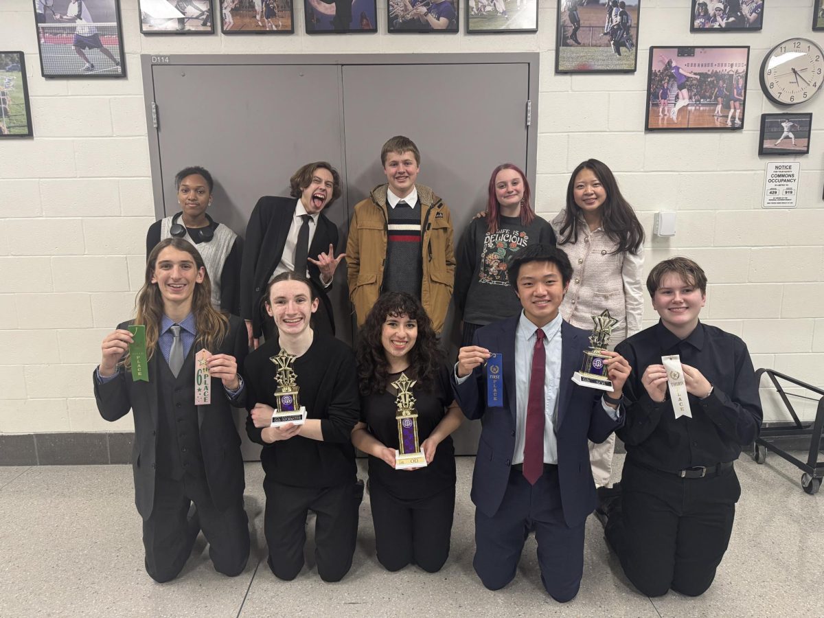 Always on cue: the GHS Speech Team poses for a picture after the awards ceremony of a tournament. Liliana Asta ‘26, Justin Lin ‘28, and Macklan Murphy ‘27 broke finals and received a trophy in compensation. In the words of Asta, who became Tournament Champion at that competition in the event of Oratorical Declamation, “This was my favorite part of the season, as well as the number of friends I made.”